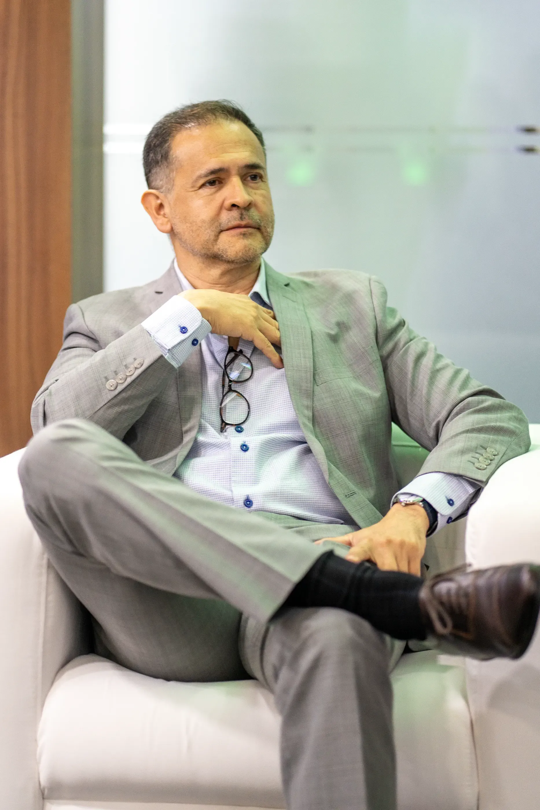 Harold H. Mesa listening to a speaker during the panel
